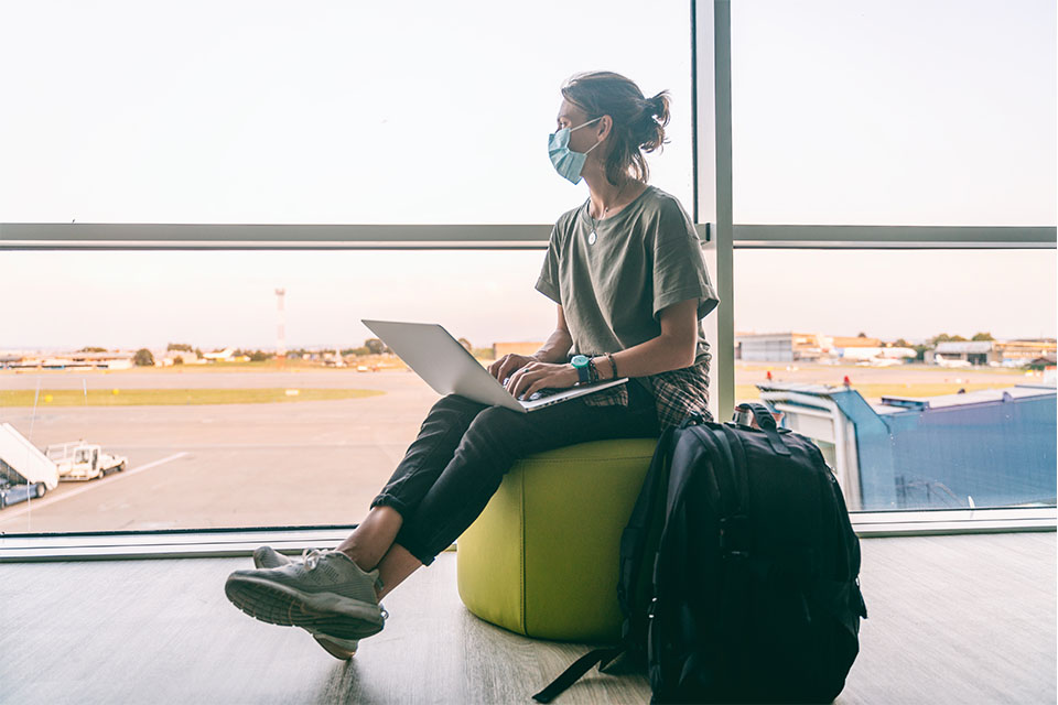 Woman works from airport.