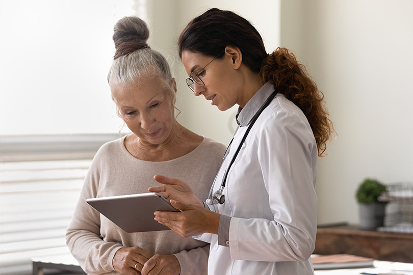 The doctor is explaining the weight loss process to the elderly lady.