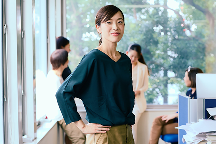 women standing in office with smile