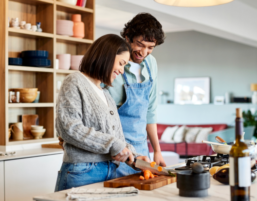 Man and woman prepare healthy food.