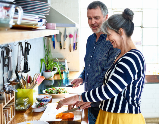 Man and woman prepare healthy food. 