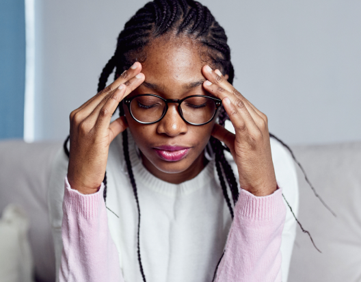 Woman feeling tired due to low iron levels.