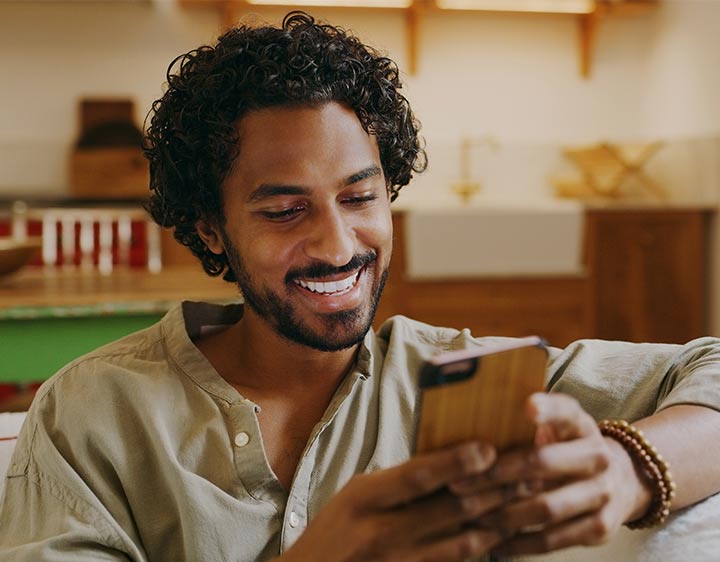 the man looking at the phone
