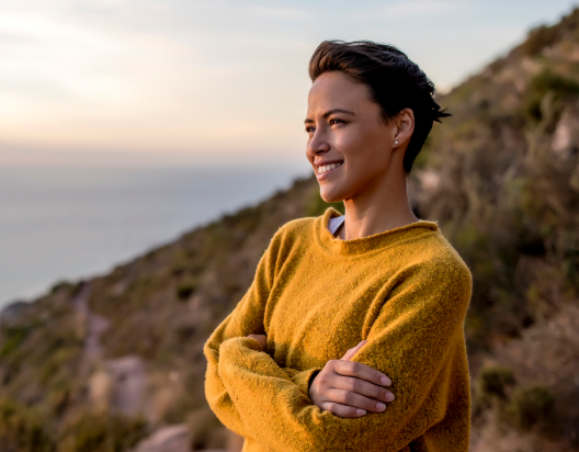 Woman enjoys sunset view.