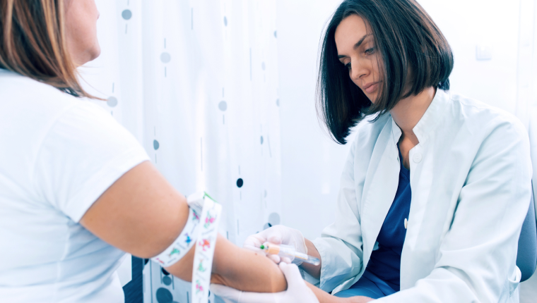 Woman takes a blood test for diabetes.