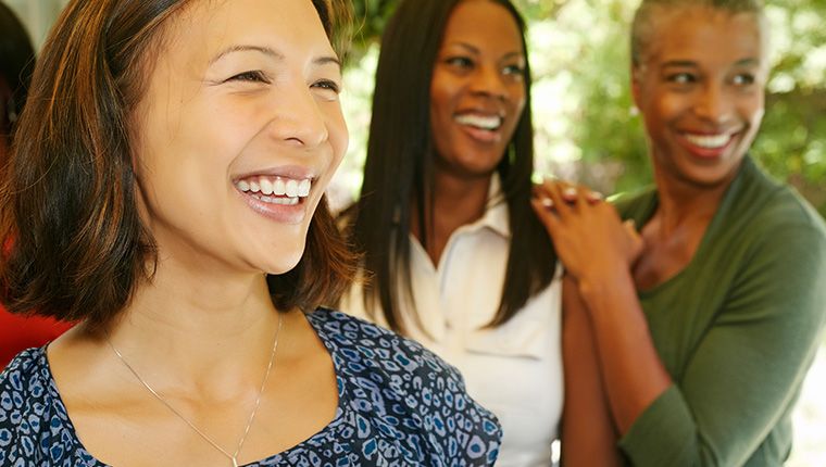 3 joyful women celebrating hormone health